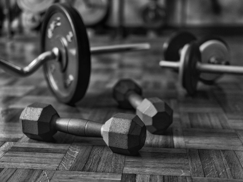 Close-up of gym equipment and iron weights on floor