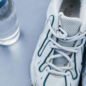 Detail of sports gear including a mat and water bottle